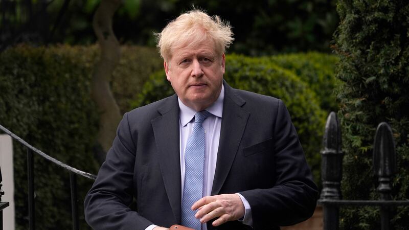 FILE - Boris Johnson leaves his house in London, on March 22, 2023.