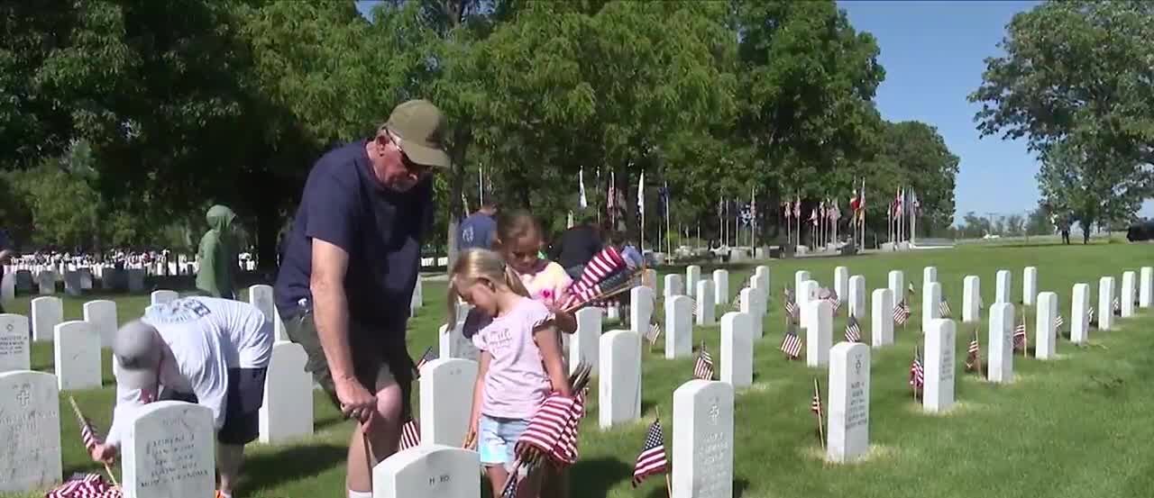 Volunteers place flags at Arsenal Cemetery ahead of Memorial Day - Vimarsana News