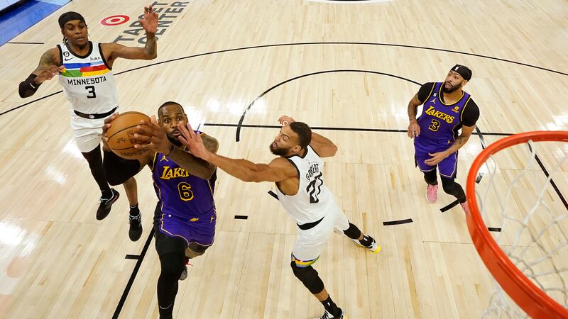 Los Angeles Lakers forward LeBron James (6) goes up for a shot against Minnesota Timberwolves...